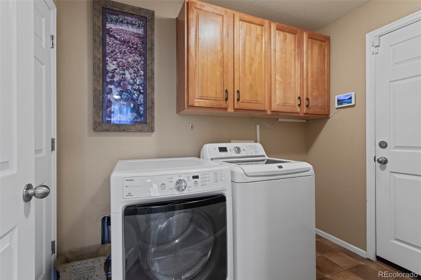 3703 South Perth Circle, Unit 101 Aurora, CO 80013 - Photo 19 of 30 a utility room with dryer and washer
