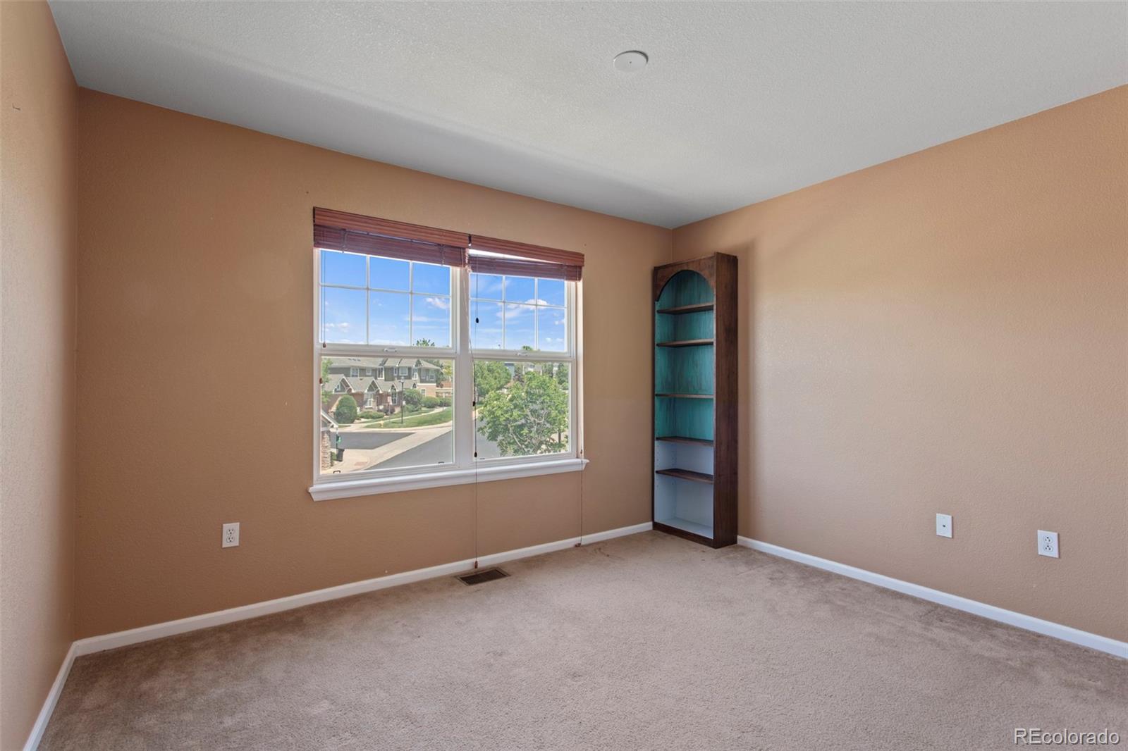 3703 South Perth Circle, Unit 101 Aurora, CO 80013 - Photo 21 of 30 an empty room with windows