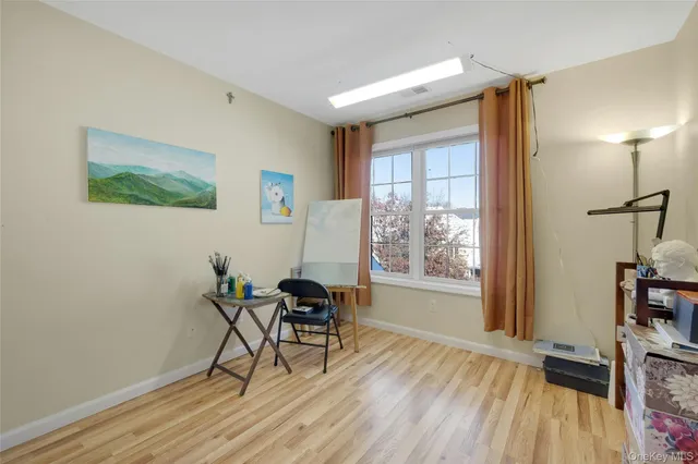 a workspace with furniture and a window