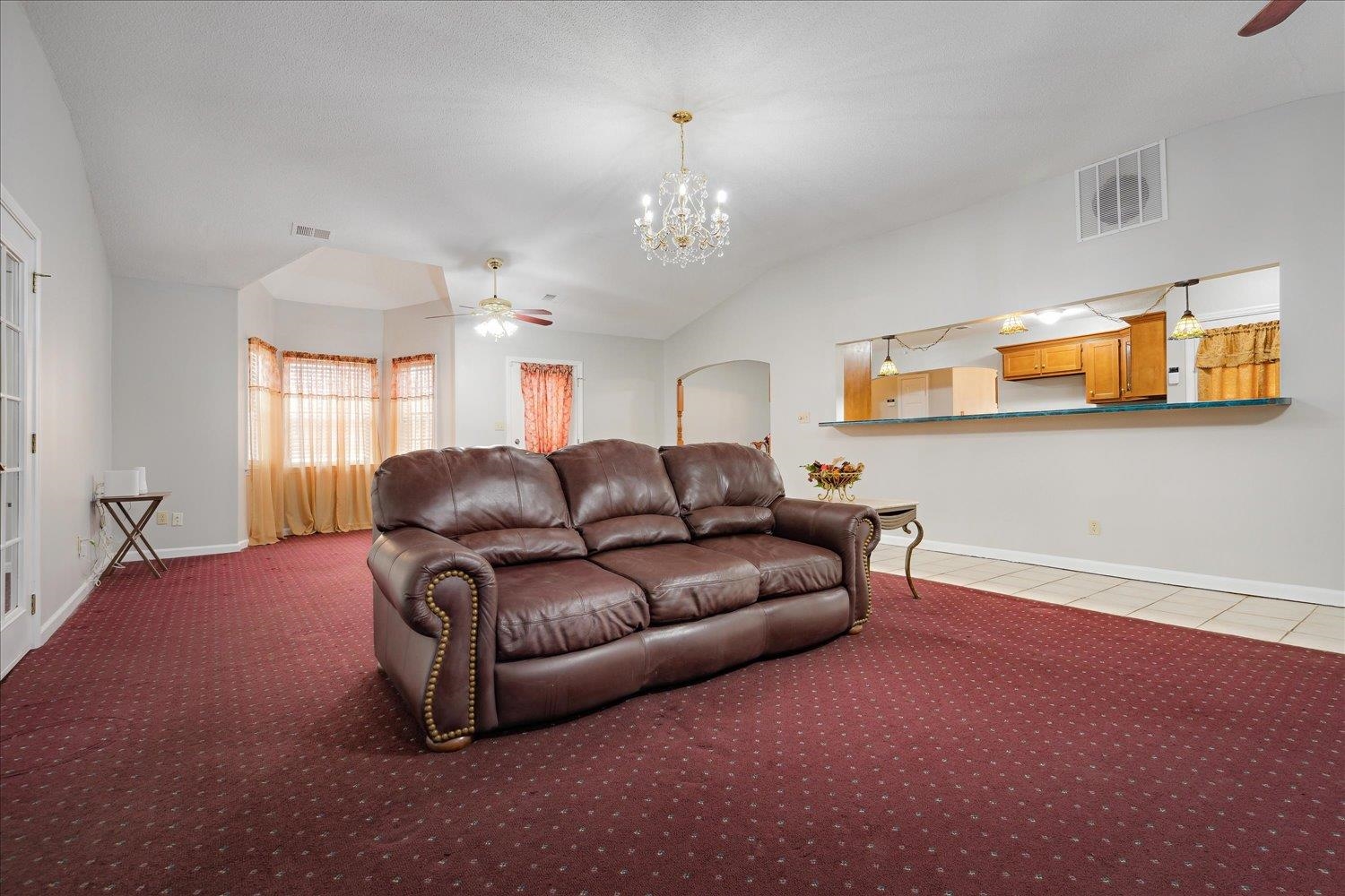 4141 Archer Drive Memphis, TN 38109 - Photo 11 of 26 a living room with furniture and a chandelier