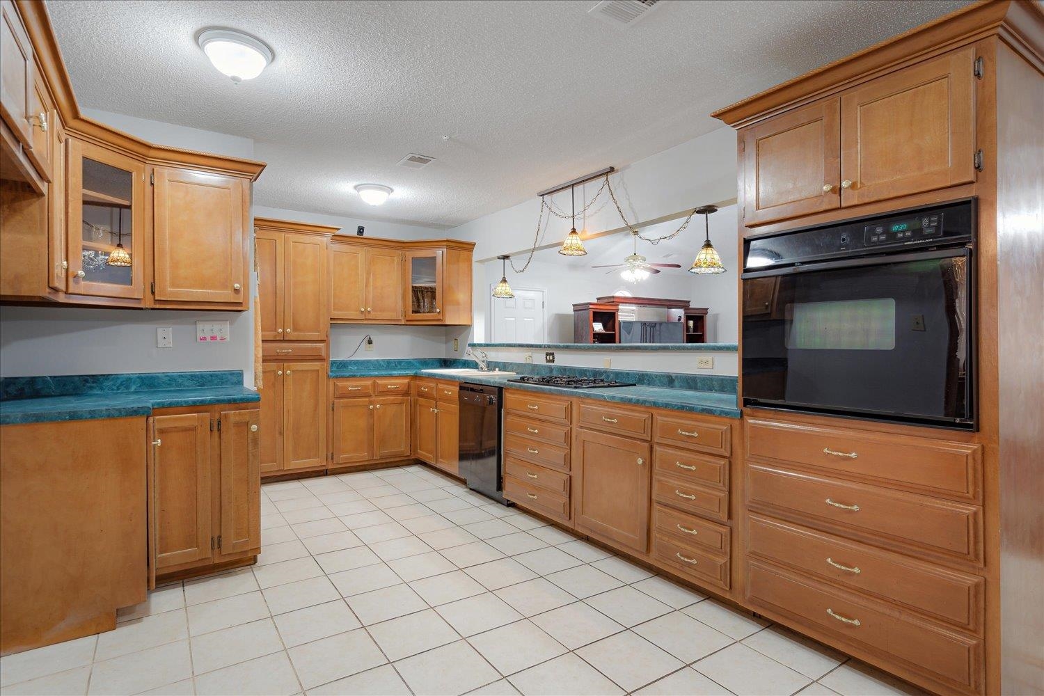 4141 Archer Drive Memphis, TN 38109 - Photo 6 of 26 a kitchen with stainless steel appliances granite countertop a stove sink and cabinets