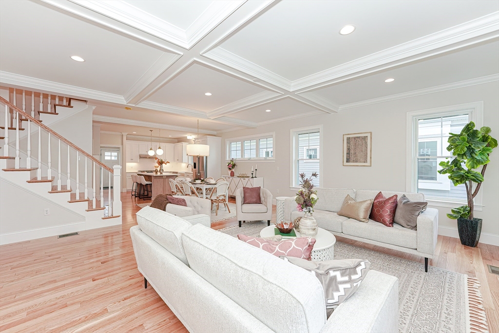 16 Damon Road, Unit 17 Needham Heights, MA 02494 - Photo 2 of 7 a living room with furniture fireplace and wooden floor