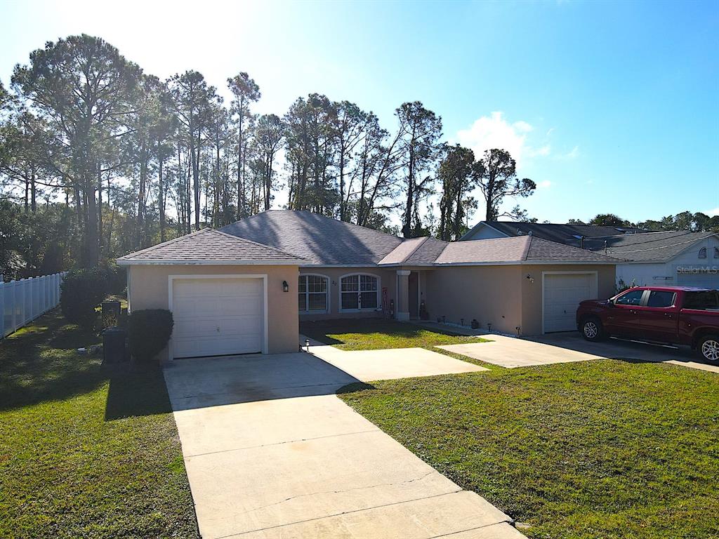 20 Plateau Lane, Unit A Palm Coast, FL 32164 - Photo 1 of 37 a view of a house with a yard