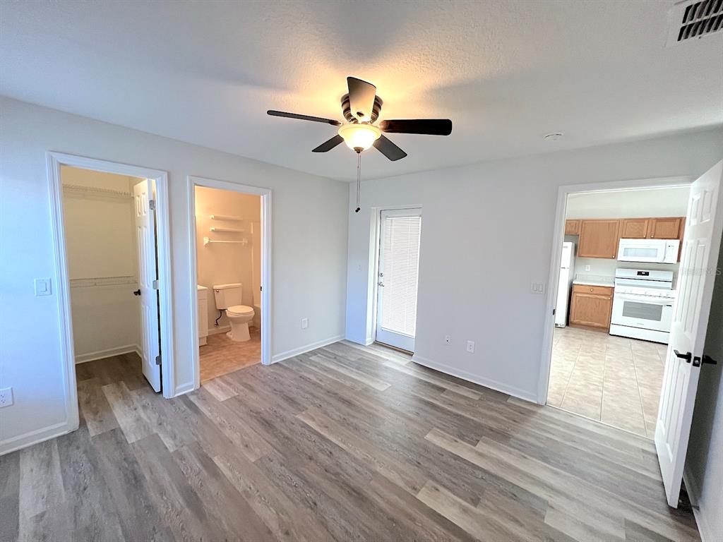 20 Plateau Lane, Unit A Palm Coast, FL 32164 - Photo 19 of 37 wooden floor in an empty room with a window