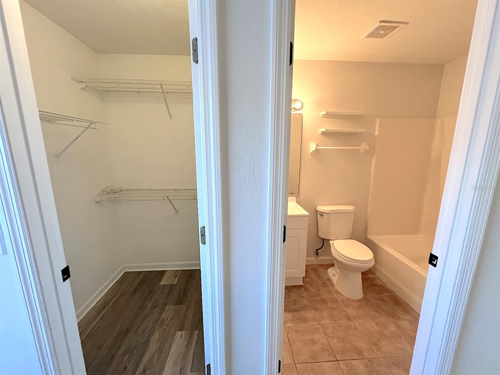 20 Plateau Lane, Unit A Palm Coast, FL 32164 - Photo 21 of 37 a bathroom with a toilet and a shower