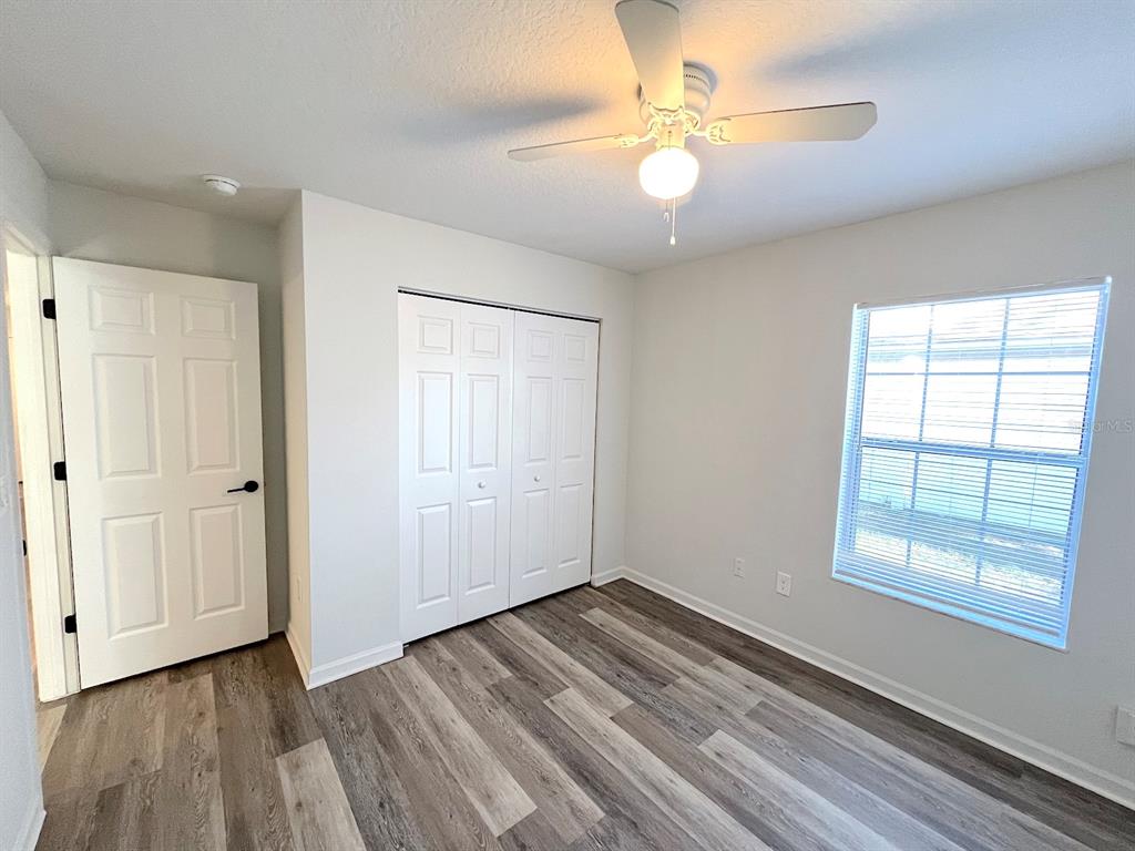 20 Plateau Lane, Unit A Palm Coast, FL 32164 - Photo 24 of 37 wooden floor in an empty room with a window