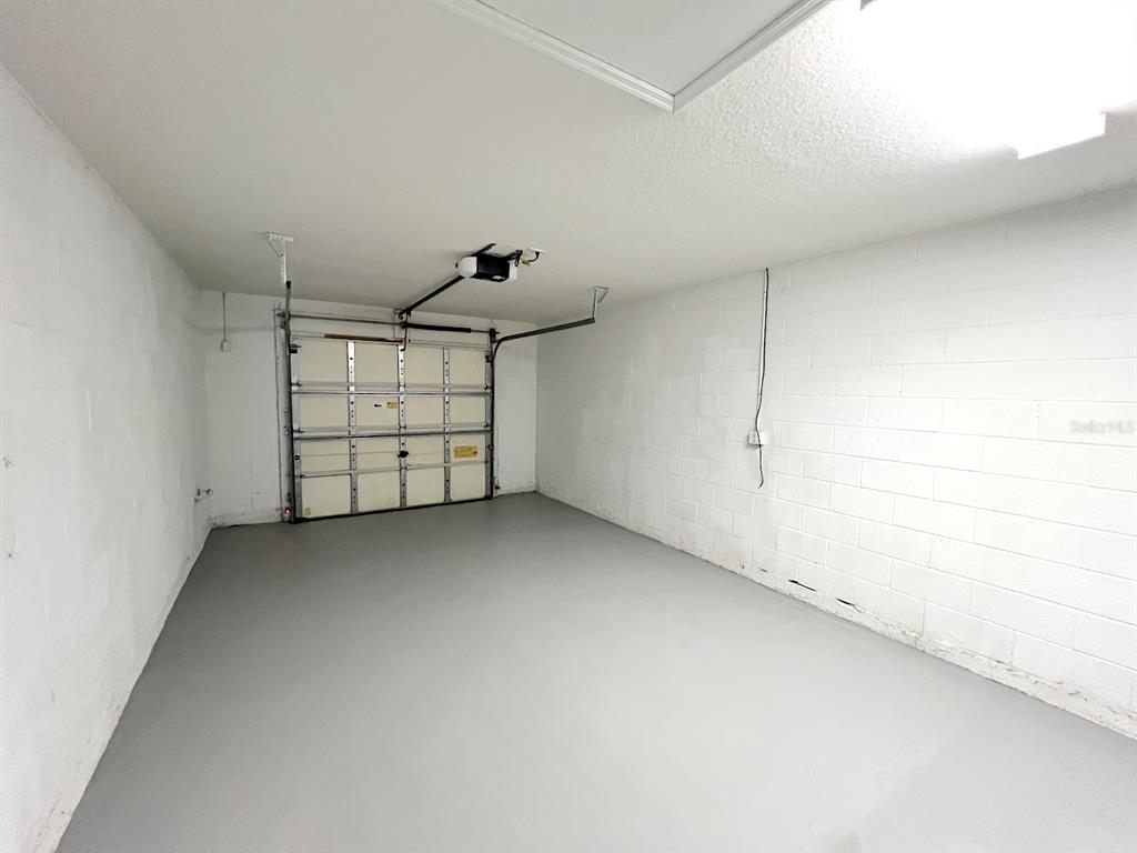 20 Plateau Lane, Unit A Palm Coast, FL 32164 - Photo 31 of 37 a view of a garage and room