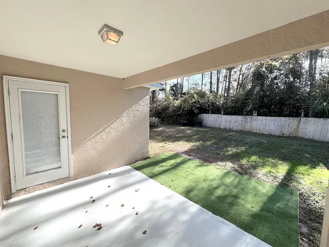 a view of wooden floor and windows in a room