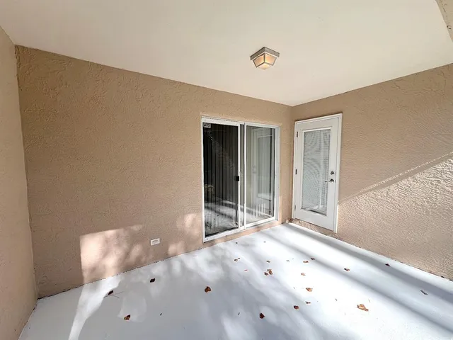 a view of a backyard with large trees