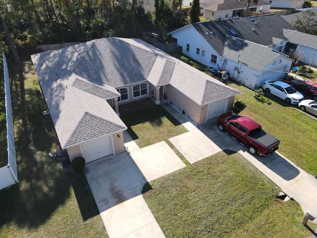 20 Plateau Lane, Unit A Palm Coast, FL 32164 - Photo 5 of 37 an aerial view of a house with a yard