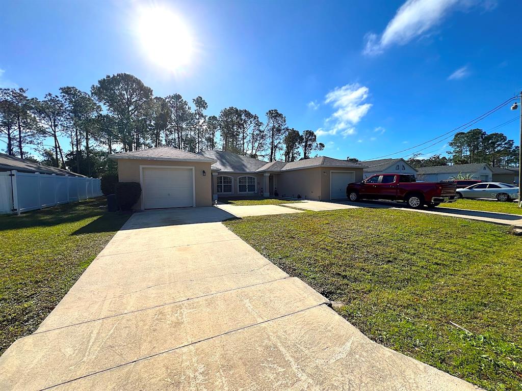 20 Plateau Lane, Unit A Palm Coast, FL 32164 - Photo 7 of 37 a view of a swimming pool with an outdoor seating and a garden