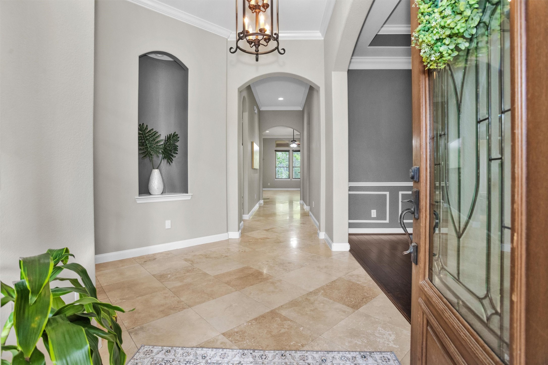 27910 Hansons Court Spring, TX 77386 - Photo 3 of 50 Welcoming foyer with art niche, 18" travertine flooring and crown molding