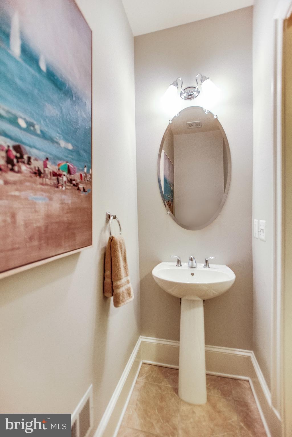 1870 Carpenter Road Alexandria, VA 22314 - Photo 21 of 30 a bathroom with a sink a mirror and vanity