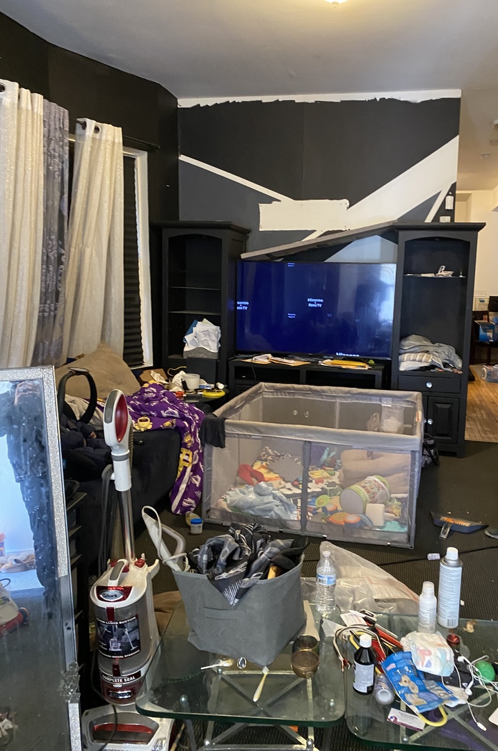 6728 South Normal Boulevard Chicago, IL 60621 - Photo 9 of 14 a room with lots of different colored cloths