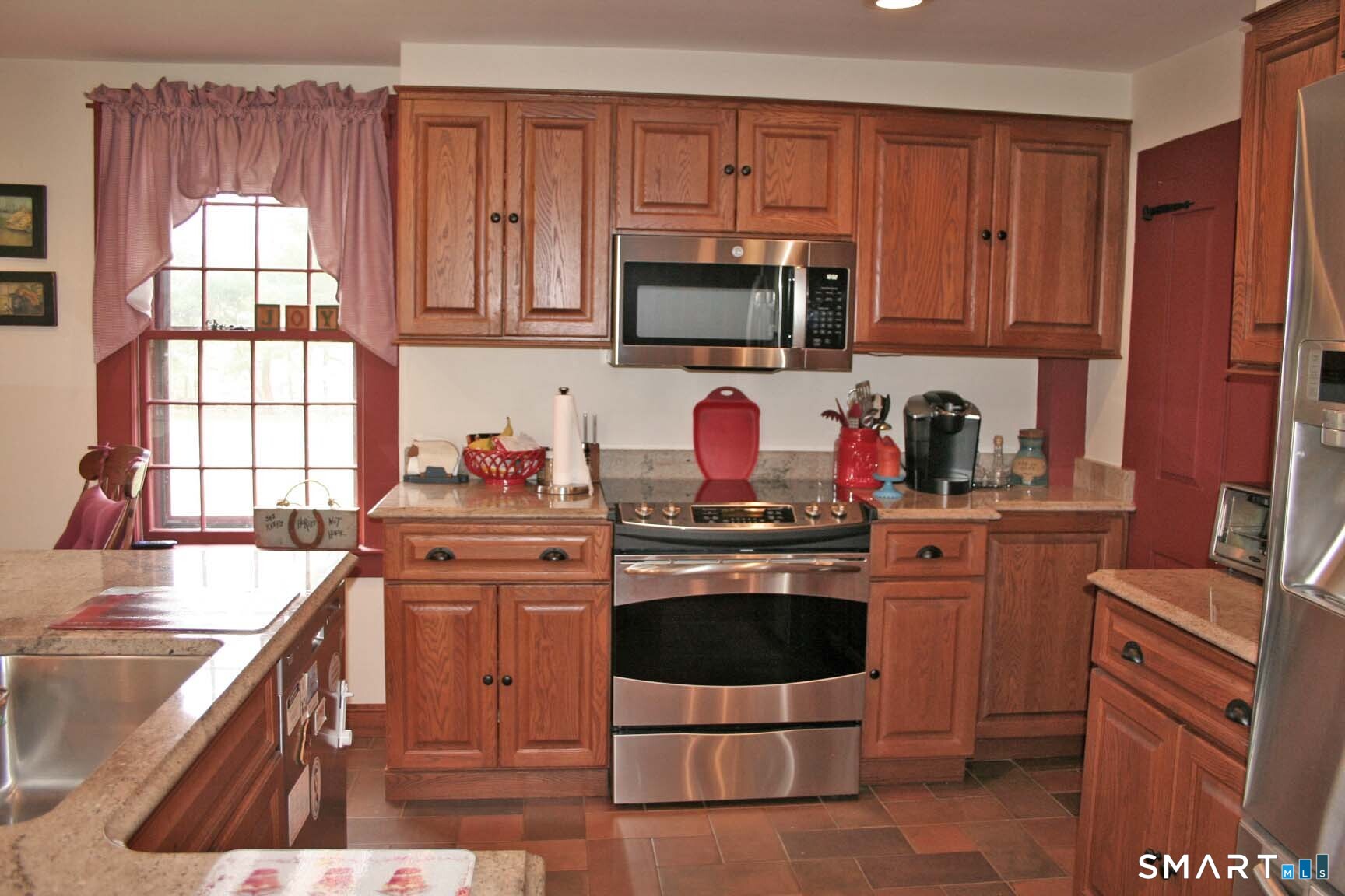 355 Wall Street Hebron, CT 06248 - Photo 12 of 39 a kitchen with stainless steel appliances granite countertop a stove a sink dishwasher and a microwave oven with cabinets