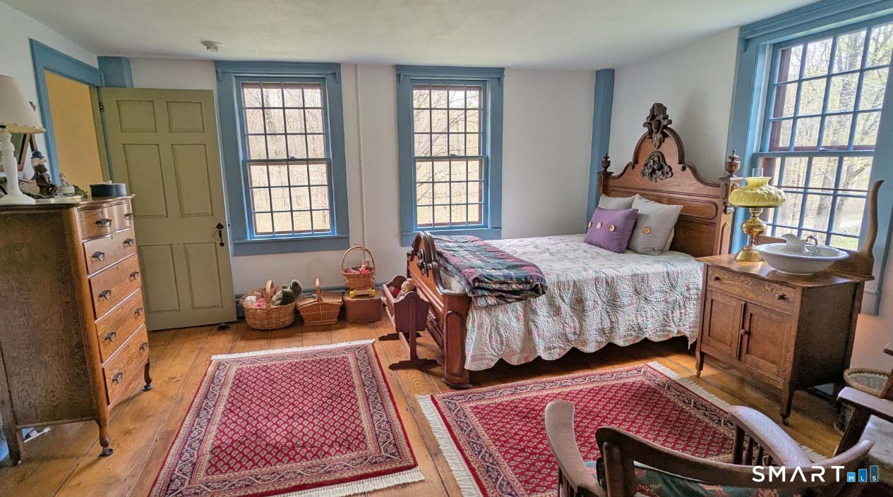 355 Wall Street Hebron, CT 06248 - Photo 23 of 39 a bedroom with furniture and a window