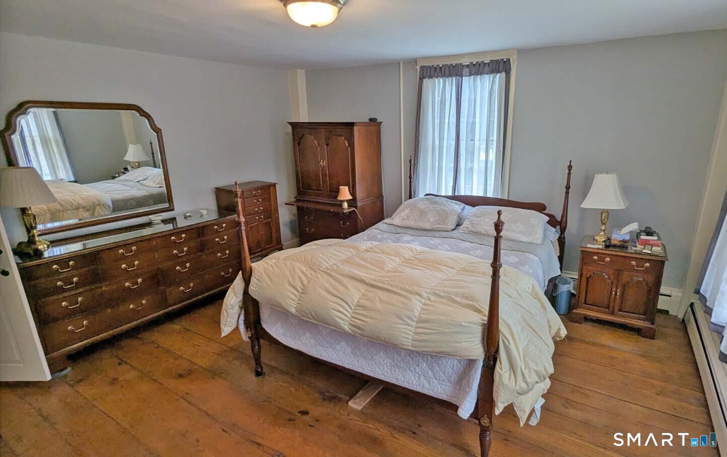 355 Wall Street Hebron, CT 06248 - Photo 25 of 39 a bedroom with a bed a dresser and mirror