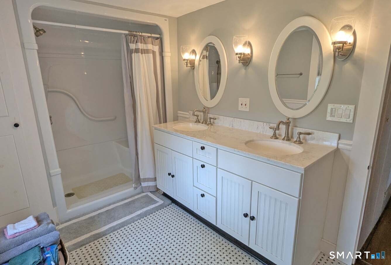 355 Wall Street Hebron, CT 06248 - Photo 29 of 39 a bathroom with a double vanity sink and a mirror