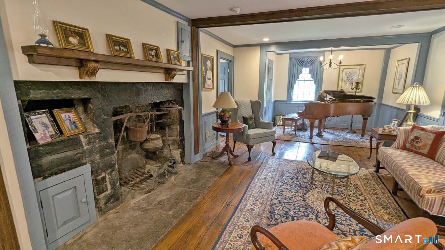 355 Wall Street Hebron, CT 06248 - Photo 3 of 39 a living room with furniture and a fireplace