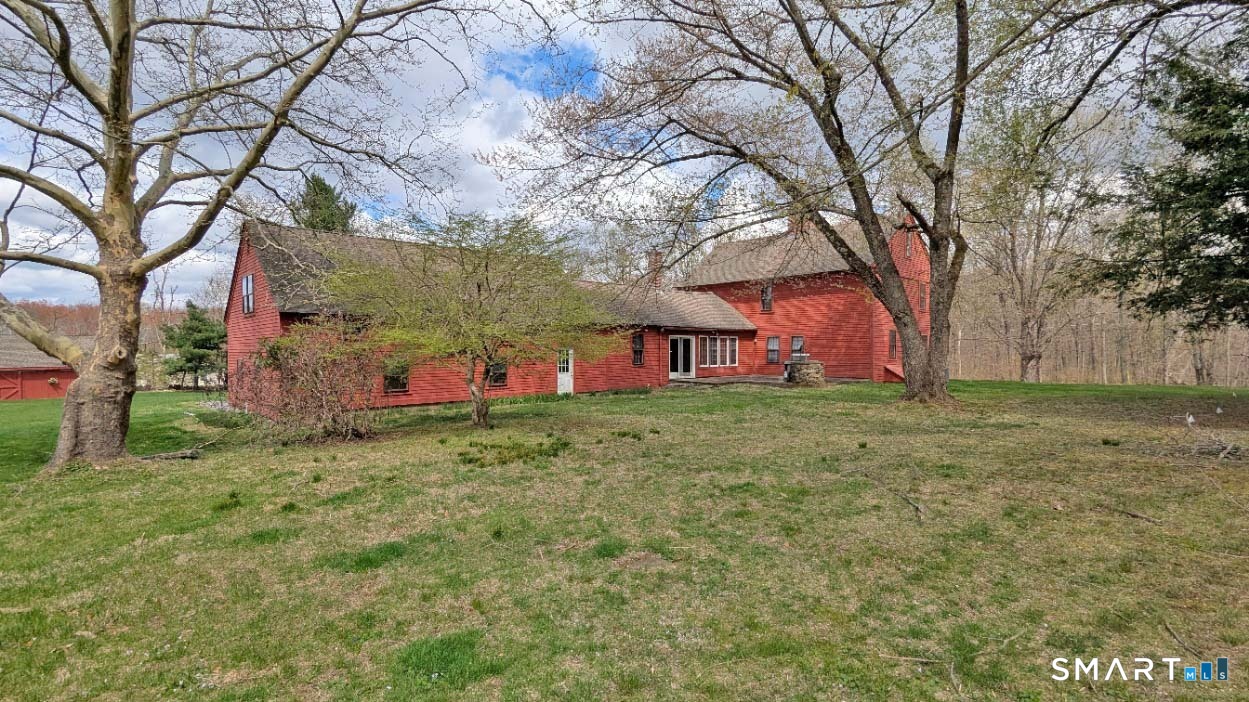 355 Wall Street Hebron, CT 06248 - Photo 32 of 39 a front view of a house with garden