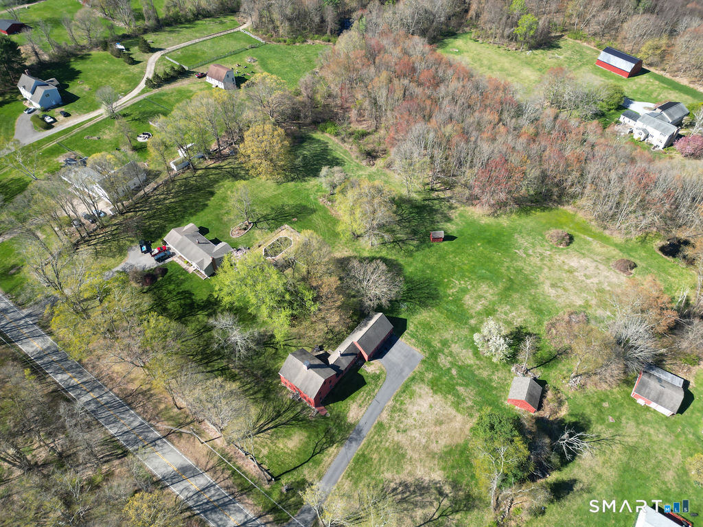 355 Wall Street Hebron, CT 06248 - Photo 37 of 39 a backyard of a house with a yard and outdoor seating