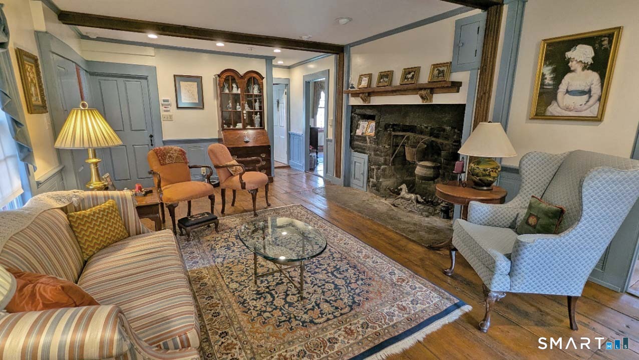 355 Wall Street Hebron, CT 06248 - Photo 4 of 39 a living room with furniture and a fireplace