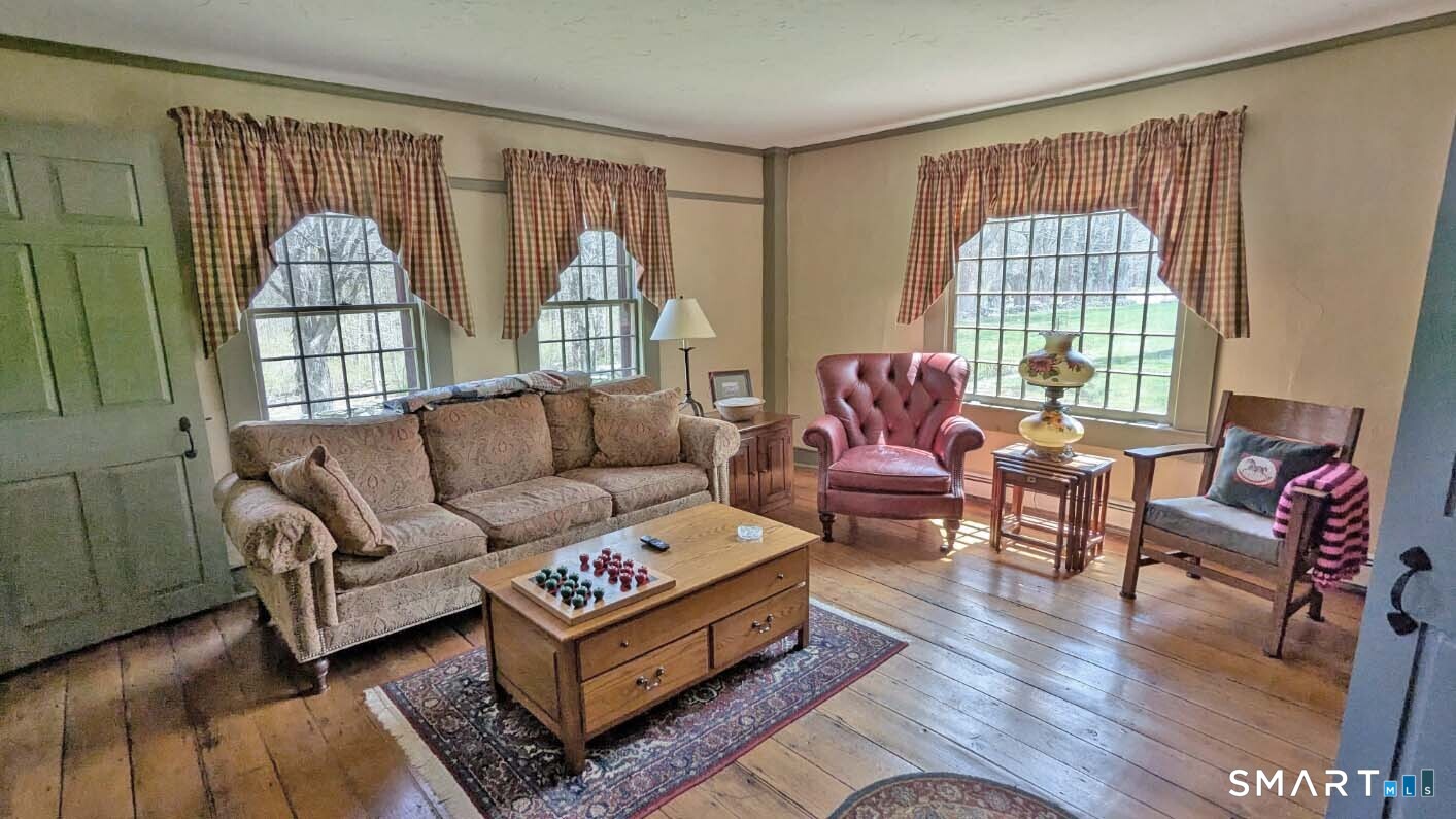 355 Wall Street Hebron, CT 06248 - Photo 7 of 39 a living room with furniture and a window