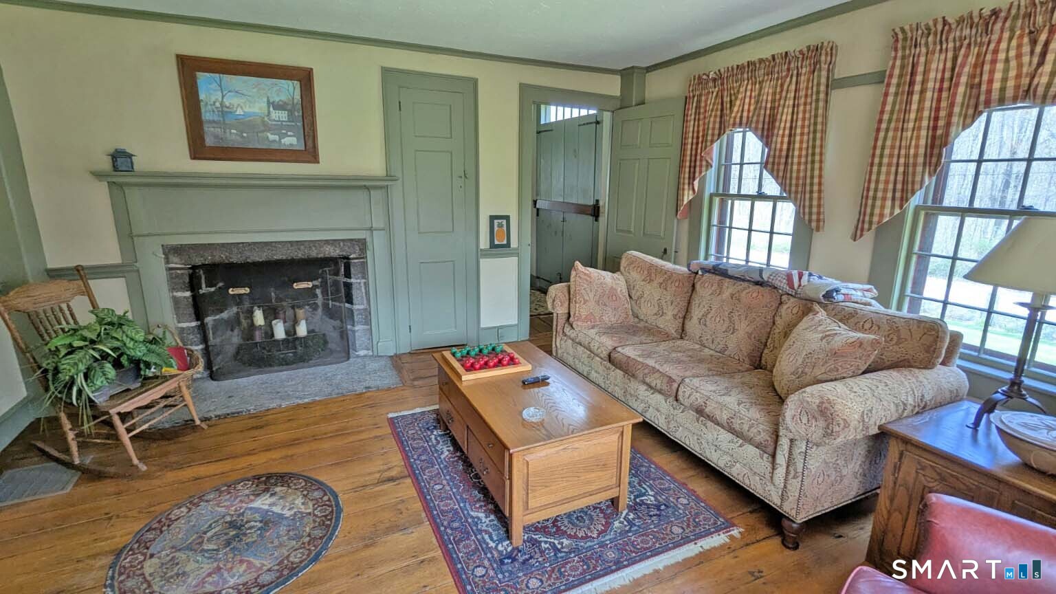 355 Wall Street Hebron, CT 06248 - Photo 8 of 39 a living room with furniture and a fireplace