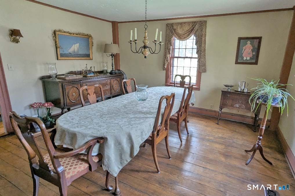 355 Wall Street Hebron, CT 06248 - Photo 10 of 39 a view of a dining room with furniture and wooden floor