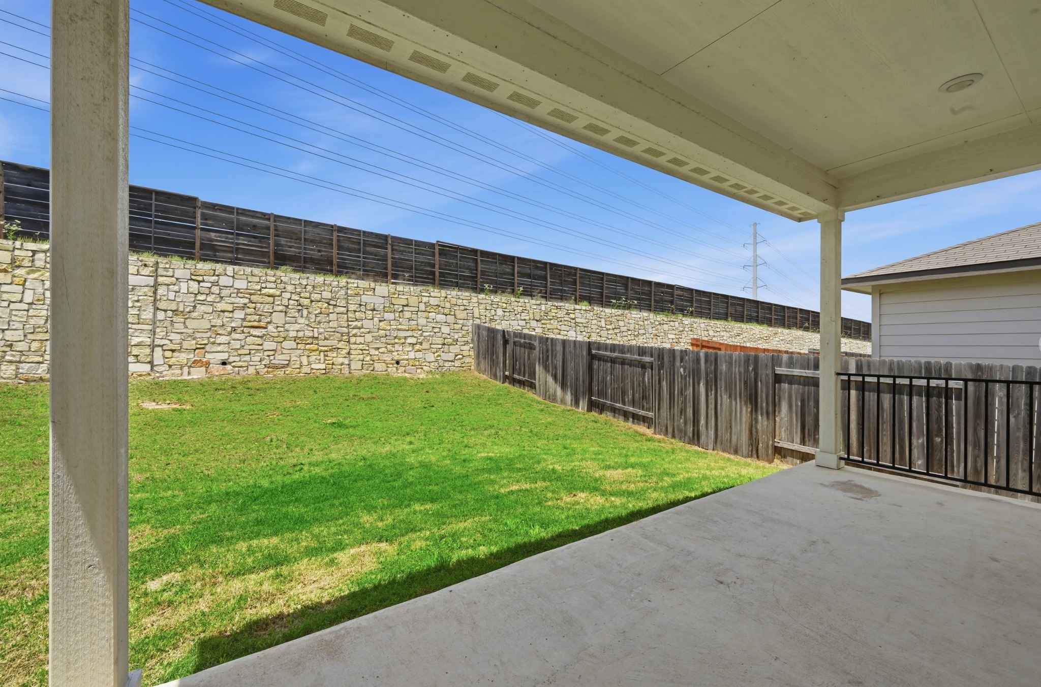 12606 Dairywork Road Buda, TX 78610 - Photo 28 of 32 The patio stays shaded and comfortable, making it a great spot to sit outside with a drink after work