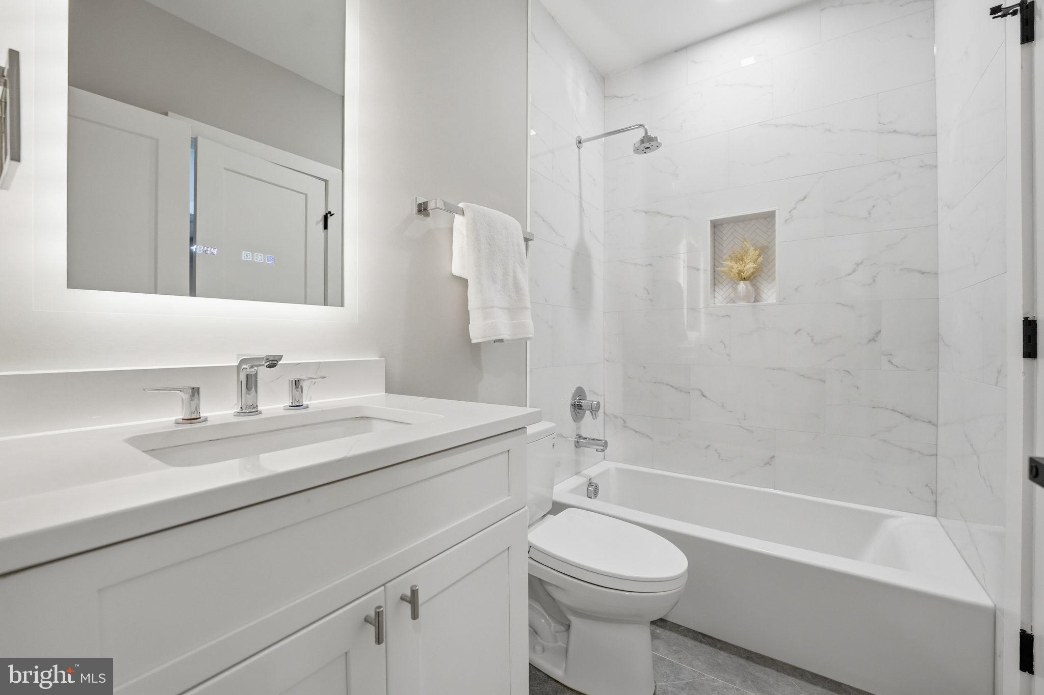 2211 Military Road Arlington, VA 22207 - Photo 86 of 107 Sleek modern bathroom with marble accents.