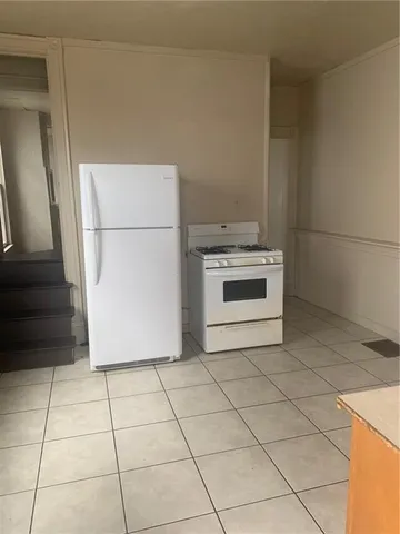 a kitchen with a stove and a refrigerator
