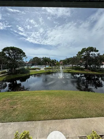 a view of a lake with houses in the back