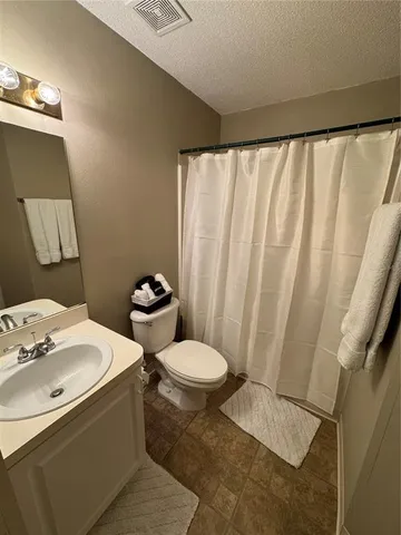 a bathroom with a sink and toilet