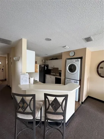 a kitchen with a table and chairs in it