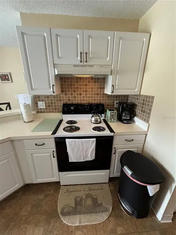 a kitchen with a stove and a sink