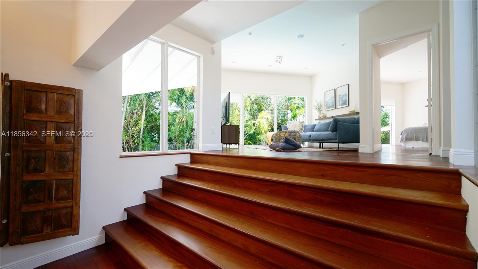 691 Ridgewood Road Key Biscayne, FL 33149 - Photo 14 of 67 a living room with furniture fireplace and large window
