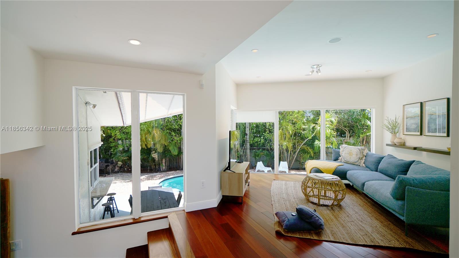 691 Ridgewood Road Key Biscayne, FL 33149 - Photo 15 of 67 a living room with furniture and a large window