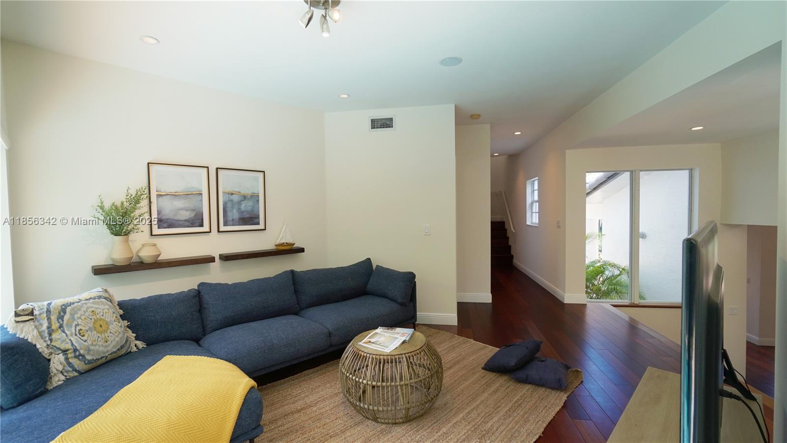 691 Ridgewood Road Key Biscayne, FL 33149 - Photo 17 of 67 a living room with furniture and a wooden floor