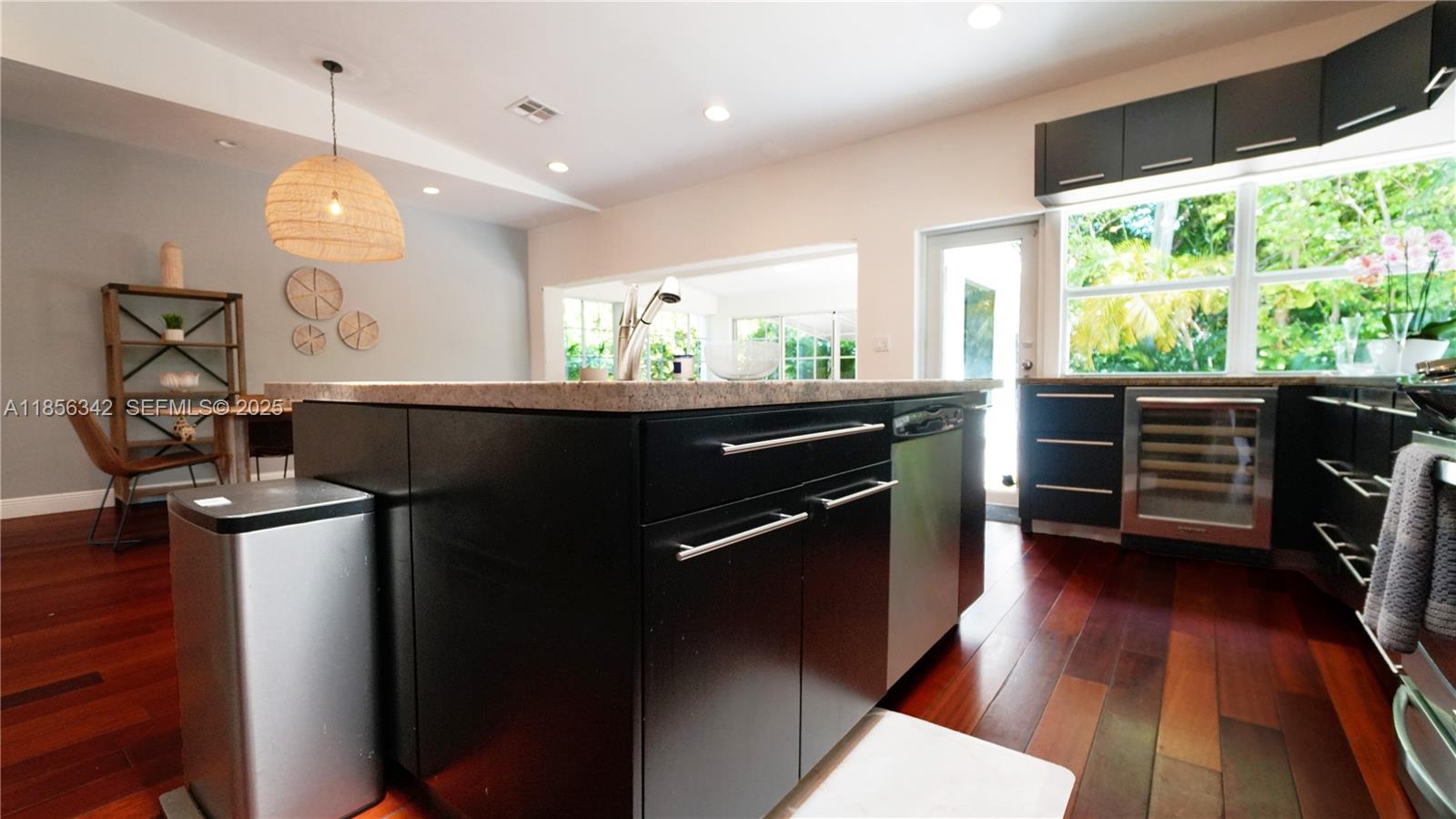 691 Ridgewood Road Key Biscayne, FL 33149 - Photo 22 of 67 a kitchen with a sink and wooden floor