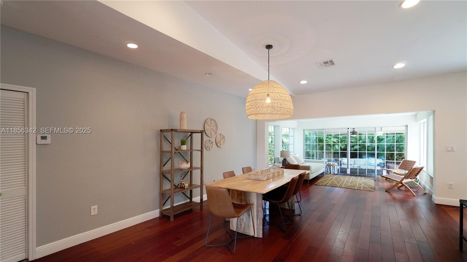 691 Ridgewood Road Key Biscayne, FL 33149 - Photo 23 of 67 a view of a dining room with furniture window and wooden floor