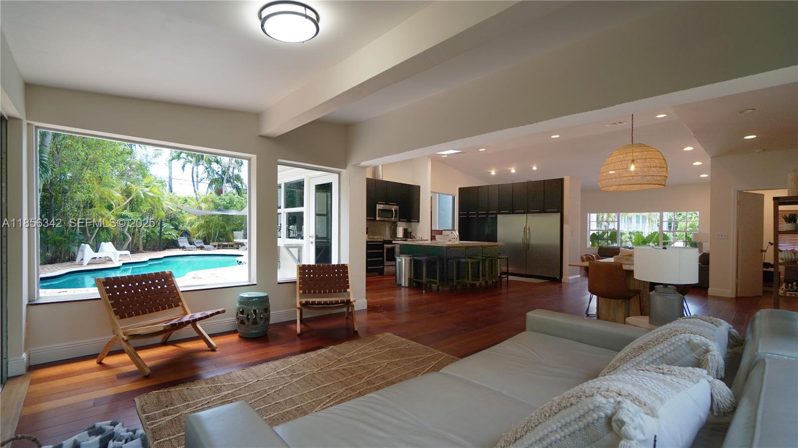 691 Ridgewood Road Key Biscayne, FL 33149 - Photo 26 of 67 a living room with furniture and a large window
