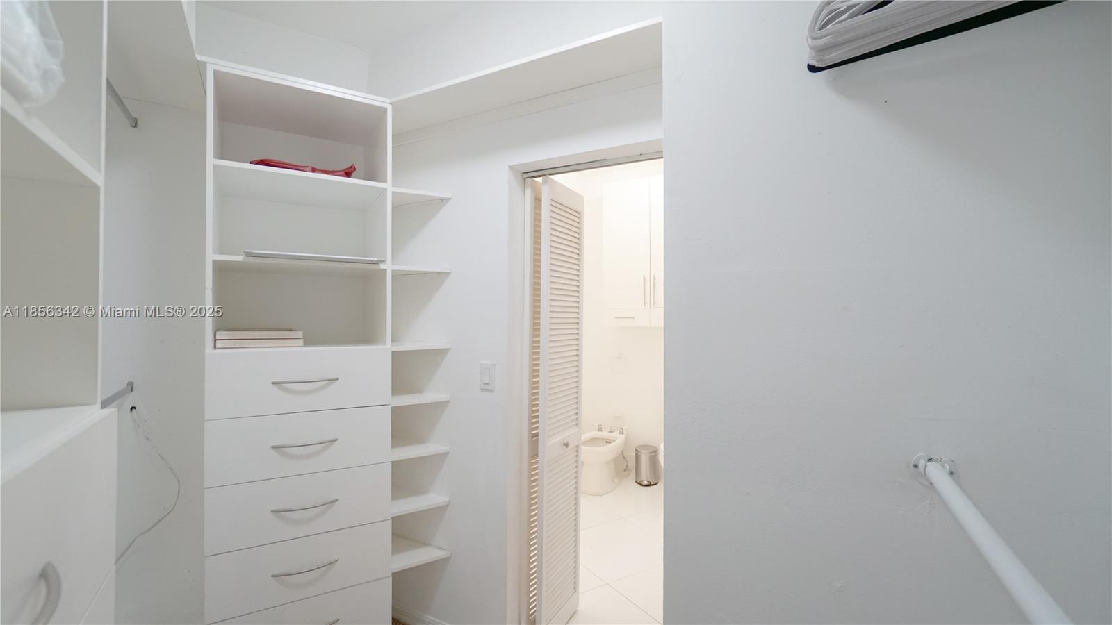 691 Ridgewood Road Key Biscayne, FL 33149 - Photo 31 of 67 a view of walk in closet