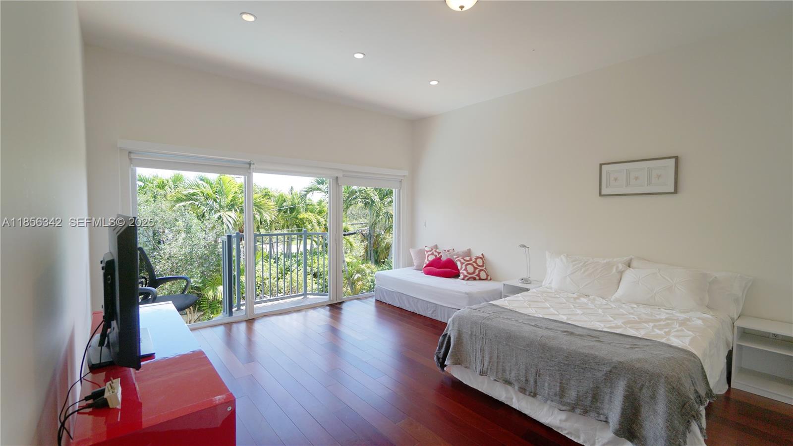 691 Ridgewood Road Key Biscayne, FL 33149 - Photo 44 of 67 a living room with furniture and a large window