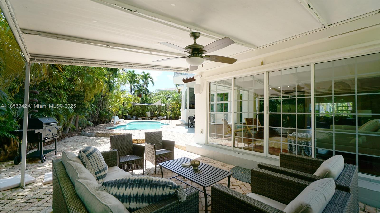 691 Ridgewood Road Key Biscayne, FL 33149 - Photo 59 of 67 a outdoor living space with furniture and garden view