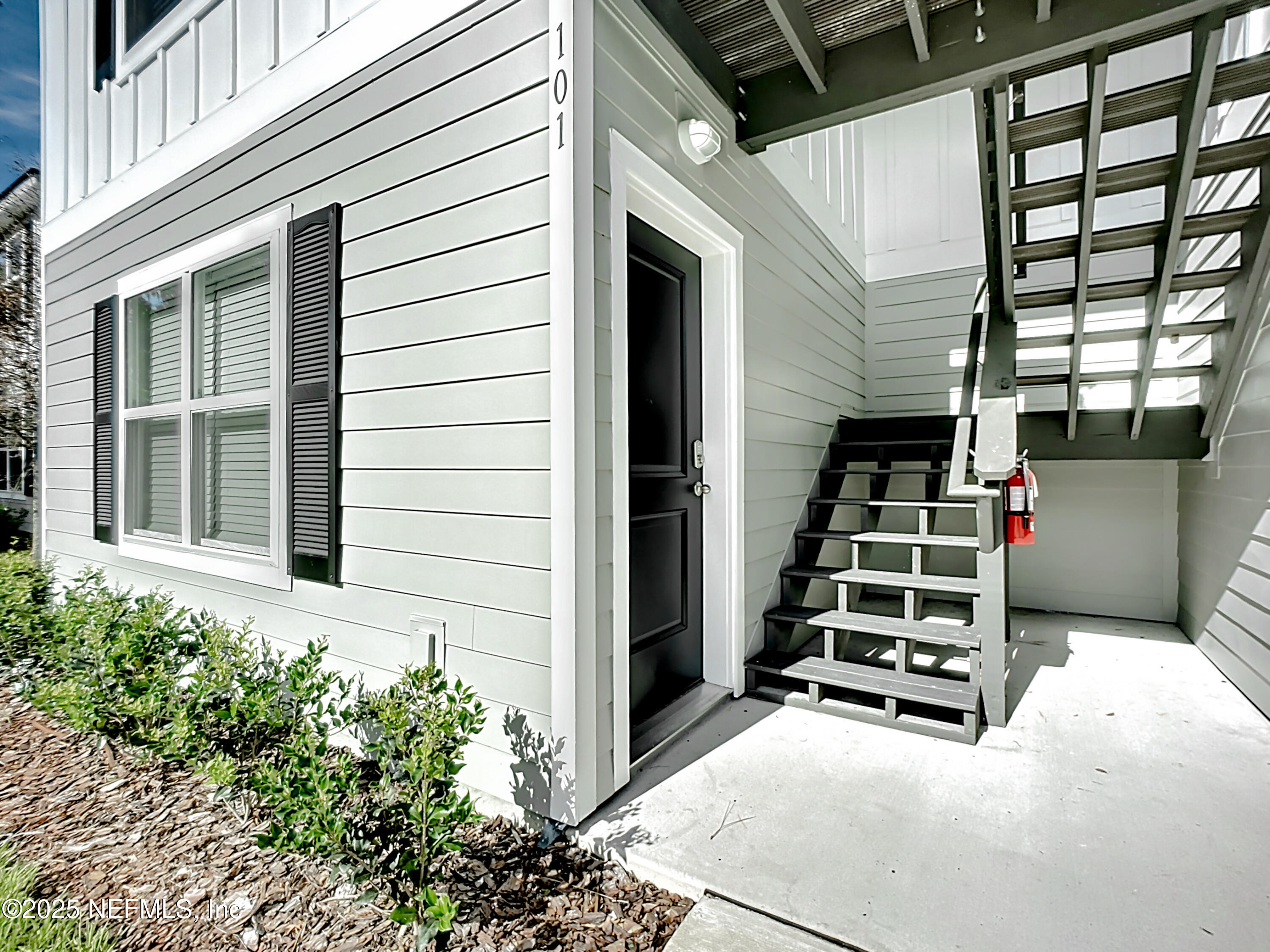 5669 George Court, Unit 101 Jacksonville, FL 32277 - Photo 2 of 10 a house view with a garden space