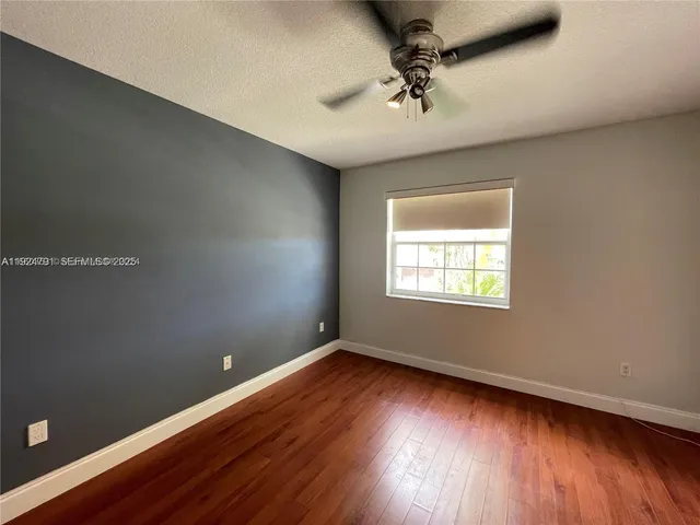 a view of swimming pool is middle in front of house