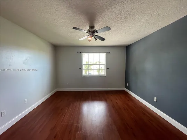 a large bathroom with a large tub and sink