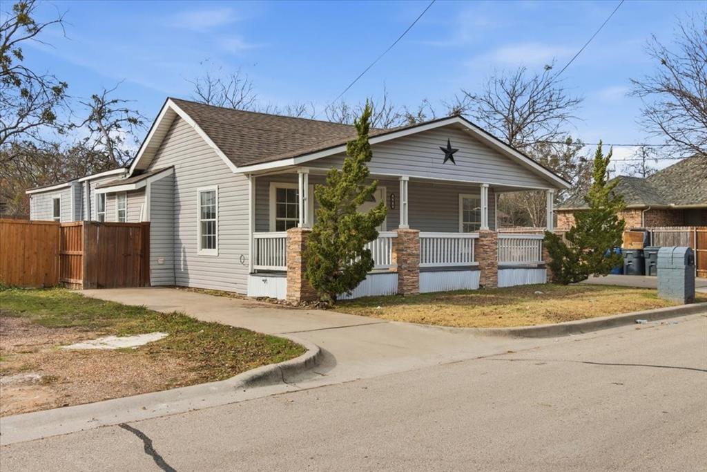 404 South Murray Street McKinney, TX 75069 - Photo 16 of 23 a view of a house with a yard and large tree