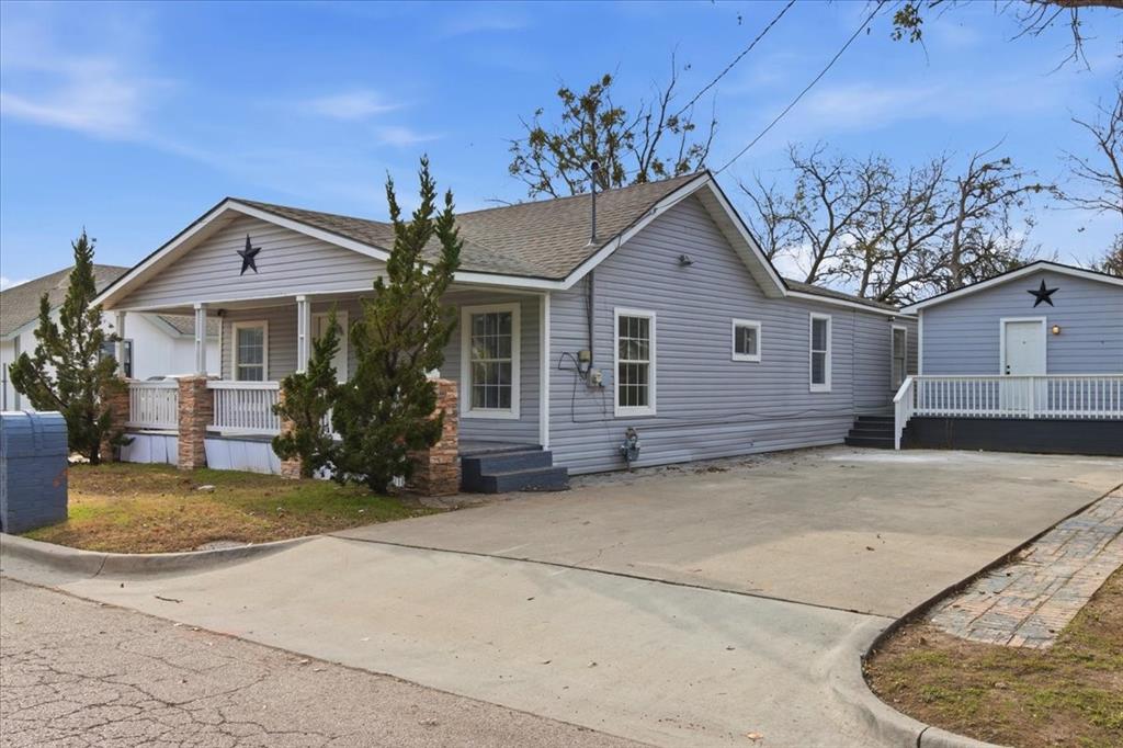 404 South Murray Street McKinney, TX 75069 - Photo 17 of 23 a view of a house with a yard and potted plants